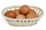 Raw Chicken Eggs Inside A Wicker Basket Stock Photo
