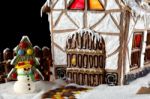 Gingerbread House And A Snowman Stock Photo