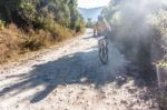 Cyclist On A Dirt Road In Guatemala Highlands Stock Photo