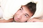 Man Trying To Sleep With Pillow Stock Photo