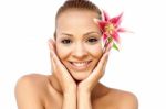Spa Woman With Lily Flower In Hair Stock Photo