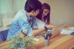 Teamwork, Young Businesswoman In Office In Casual Shirt. Selecting Information With Colleagues With A Computer. Business Marketing Planning Stock Photo