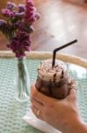 Top View Of Iced Chocolate On Glass Table Stock Photo