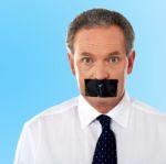 Businessman With Tape On His Mouth Stock Photo
