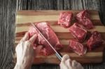 Cutting Angus Beef On The Wooden Table Horizontal Stock Photo