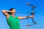 Young Woman Aiming Arrow Of Compound Bow Stock Photo