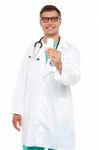 Smiling Doctor Showing Tablets Stock Photo