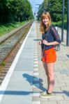 Dutch Teenage Girl Standing At Station Waiting On Train Stock Photo