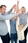 Jubilant Family Celebrating And Partying Indoors Stock Photo
