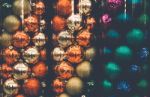Christmas Ornaments In Tubes Background Stock Photo