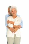 Hugging Elder Couple Stock Photo