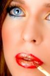 Close Up Of Model Putting Lipstick Stock Photo