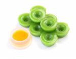 Green Multiple Scented Chinese Sweet And Liquid Sugar On White Floor Stock Photo
