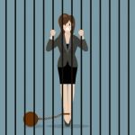 Business Woman With Weight In Prison Stock Photo