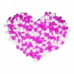 Heartshape Of Pink Capsules Stock Photo