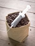 Coffee Bean And Syringe Stock Photo