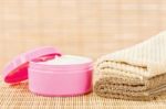 Cream In Pink Cup With Towels Stock Photo