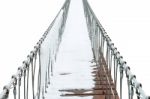 Suspension Bridge Of Iron Chain And Woods In Winter On White Background Stock Photo
