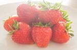 Fresh Ripe Strawberries On White Plate Stock Photo