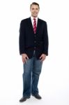 Ful Length Portrait Of Young Businessman In Jeans Stock Photo