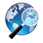 Magnifying Glass With Earth Globe Stock Photo