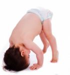 Baby Bending Down Frontwards Stock Photo
