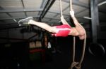 Crossfit Rope Climb Training On A Dark Background Stock Photo