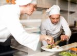 Young Chefs Preparing Delicious Dishes Stock Photo