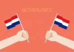 Netherlands National Day With Hands Holding Up Netherlands Flags Stock Photo
