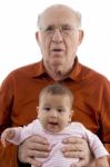 Grandpa Holding His Grandchild Stock Photo