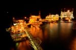The Large Offshore Oil Rig At Night Stock Photo