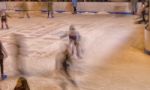 Skaters Moving On The Ice Rink Stock Photo