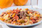 Brown Beans With Meat And Carrot Stock Photo