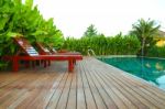 Lounger In Swimming Pool Stock Photo