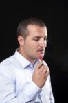Men Smoke An Electronic Cigarette Stock Photo