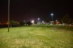 Night Public Park In The City With Houses Near Stock Photo