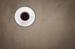 Top View Of Coffee Cup On Gray Concrete Background Stock Photo