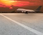 Jet Plane Landing On Runway Stock Photo