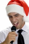 Young Man Singing Into Microphone Stock Photo