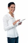 Woman Browsing On New Touch Pad Device Stock Photo