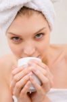 Woman In Spa Holding Cup Near Mouth Stock Photo