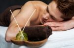 Young Man Relaxing On Massage Table Stock Photo