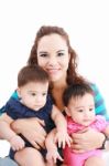 Young Mother With Two Babies Stock Photo
