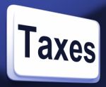 Taxes Button Shows  Tax Or Taxation Stock Photo