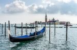 Gondola Moored At The Entrance To The Grand Canal Stock Photo