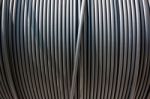 Close-up Of Black Electricity Cable Verticla On A Spool Stock Photo