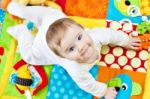 Infant Boy On Playmat Stock Photo