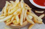 French Fries On Wooden Stock Photo