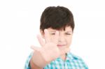 Small Boy Showing Stop Signal Stock Photo
