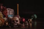 Skull And Gifts On Wooden Stock Photo